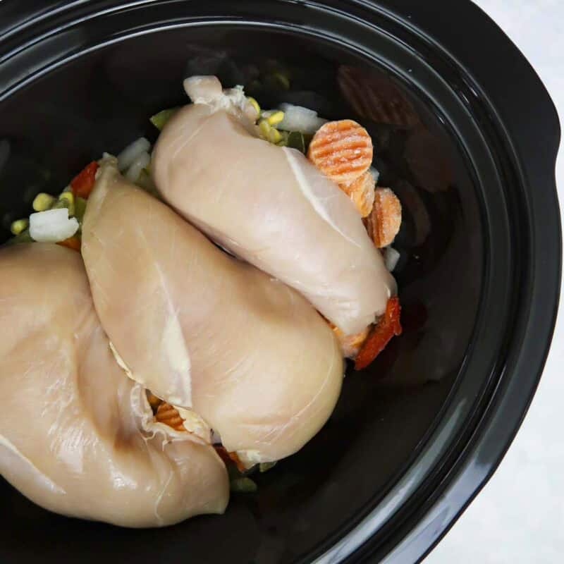 Overhead view of process shot 2 - place chicken breasts on top.