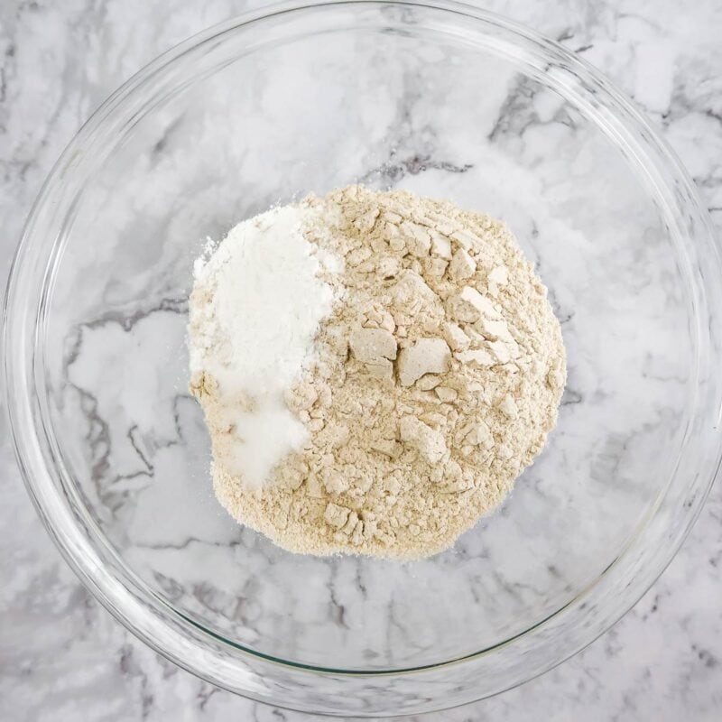 Overhead view of process shot 1 - add the flour, baking powder, salt, and sugar to a large bowl and mix to combine.