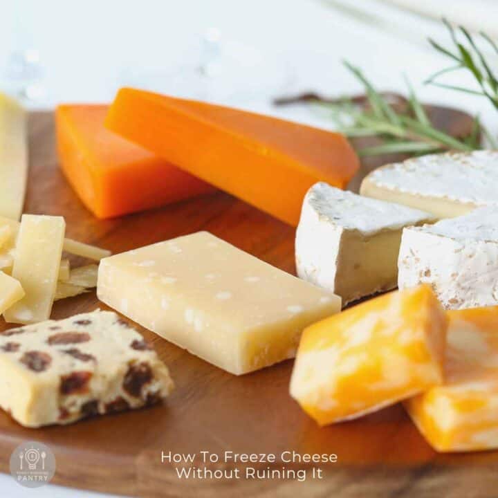 Side view of cheese blocks on a cutting board to introduce the article on how to freeze cheese the correct way.