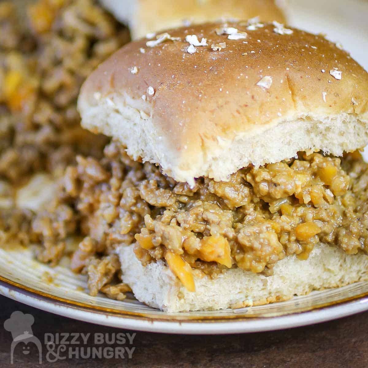 Close up side shot of two veggie sloppy joes on a white plate.