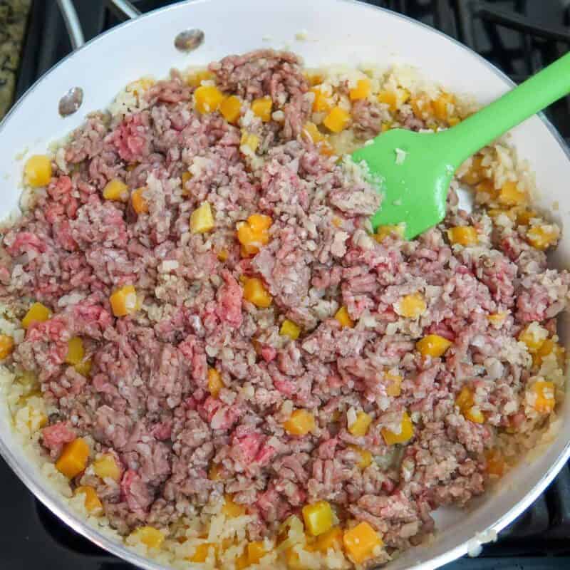 Overhead view of process shot 2 - add the ground beef and cook until brown.