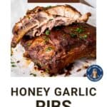 Juicy pork ribs shown with the meat falling off the bones.